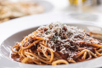 Traditional Italian spaghetti with red sauce, sprinkled with freshly grated parmesan