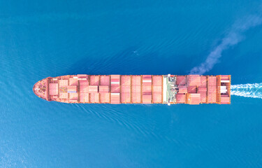 Top view Logistics and transportation of Container Cargo ship and Cargo plane with working crane bridge in shipyard at sunrise, logistic import export and transport industry background