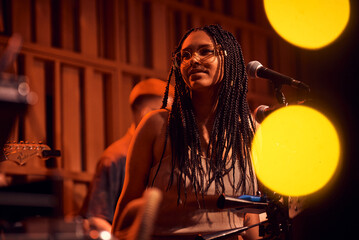 Beautiful Afro-Carribbean Girl looking pensive during live show