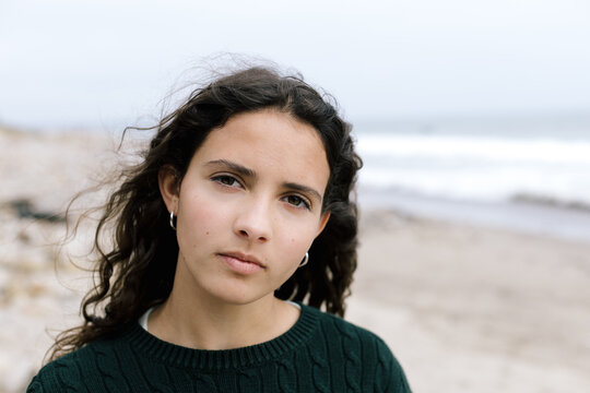 Teen Girl With A Serious Expression At The Beach
