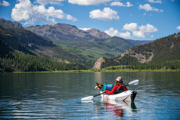 Woman with Dog Kayaking on lake San Cristobal in Colorado