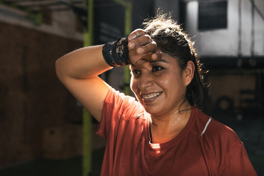 Sweaty latin woman after working out in the gym. Peru.