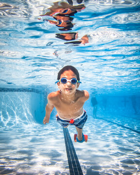 Underwater photograph of boy swimming.