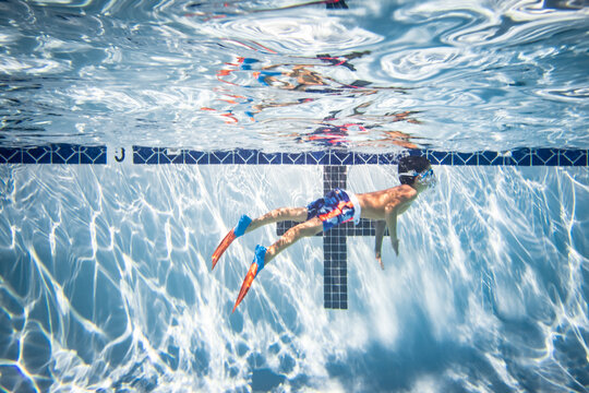 Underwater photograph of boy swimming.