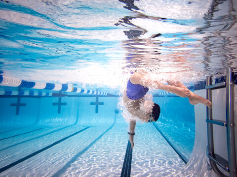 Underwater photograph of boy swimming.