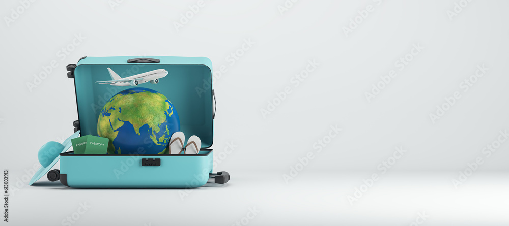 Poster abstract image of suitcase filled with airplane, globe and beach items on wide white background with