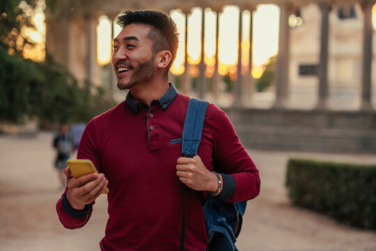 Asian tourist checking online map on smartphone