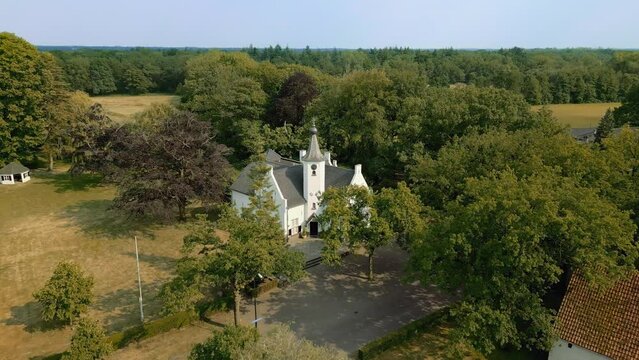 Castle Cranendonck in Brabant landscape drone with farm, forest, field moving forward