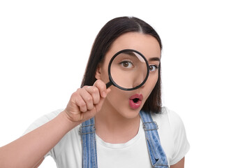 Curious young woman looking through magnifier glass on white background