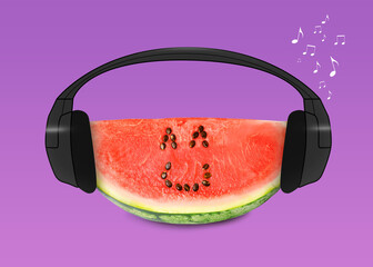 Creative artwork. Watermelon listening to music in headphones on magenta background. Slice of fruit...