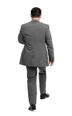 Businessman in suit walking on white background, back view