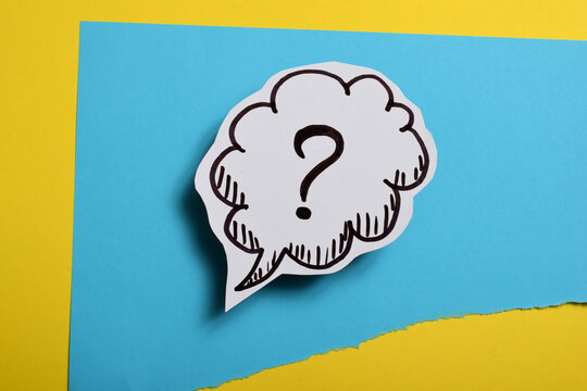 drawn question mark on a colored background - Powered by Adobe