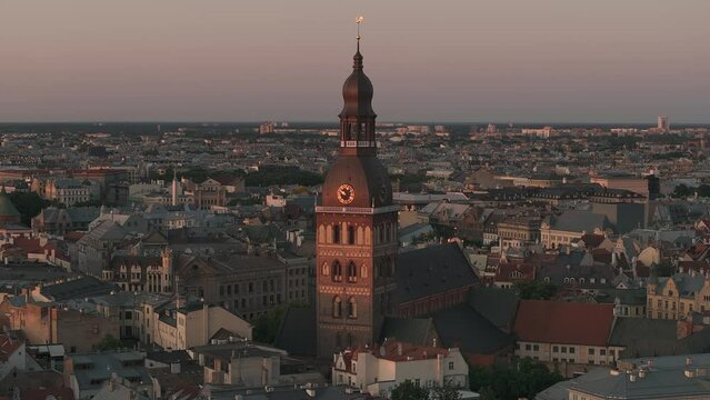 Beautiful sunset over Riga old town in Latvia. Aerial view of the Domes cathedral and old town of Riga. Warm sunset colors.