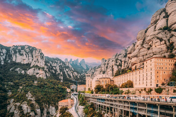 Santa Maria De Montserrat. Amazing Scenic View Colorful Sky Above Benedictine Abbey In Mountain Of Montserrat, In Monistrol De Montserrat, In Catalonia, Spain. Spirit Of Travel. - obrazy, fototapety, plakaty