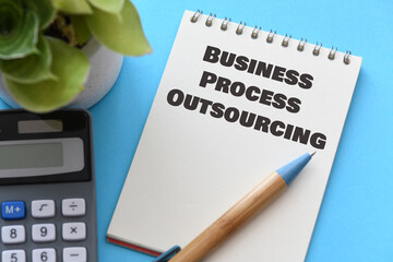 BUSINESS PROCESS OUTSOURCING CONCEPT words in an office notebook.