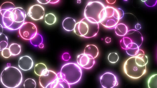 Abstract animated background. Glowing colorful bubbles on black background.