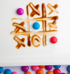 tic tac toe game design with chocolate candies