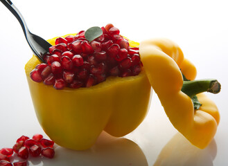 yellow capsicum bowl with pomegranate 