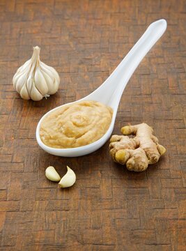 ginger garlic paste in white spoon