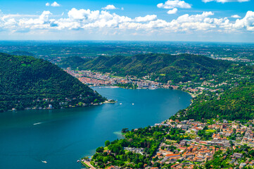 Panorama of Lake Como and the city of Como, the port and the mountains, from Cernobbio, on a summer day.
