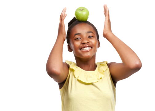 Happy black girl, portrait smile and apple on head for natural nutrition isolated on a transparent PNG background. African female child, kid or teen smiling with fruit for balance, diet or wellness - Powered by Adobe
