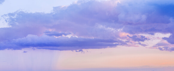 scenic blue seascape of sunset or sunrise above water with beautiful colorful evening clouds