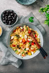 Foto op Canvas Homemade orzo pasta salad with feta, olives, tomatoes © Brebca