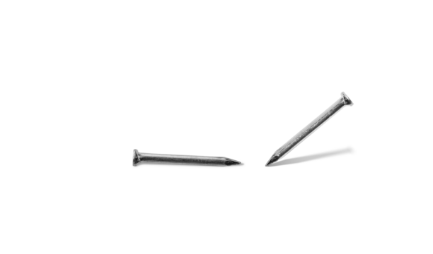Steel nail. Two metallic nails close up with shadow on white background.