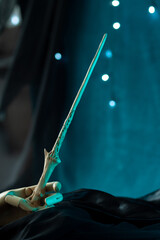Magic wand artifact in wooden hand