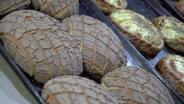 Traditional Mexican artesian bread called Concha displayed awaiting customers