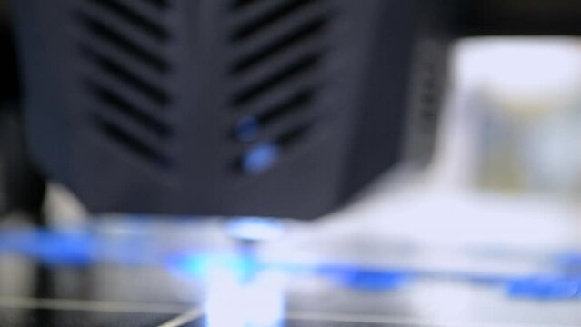 3D printer. 3D printing. 3d printer printing process close-up. 3D printer creating object from molten plastic. Modern three-dimensional printing and Innovation additive technology. Blurred background
