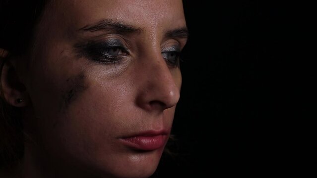 woman is crying because of domestic violence. Help and support, hopelessness or despair concept