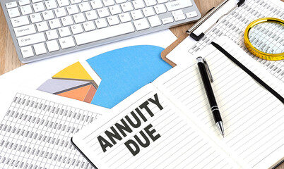 ANNUITY DUE text on notebook with chart and keyboard