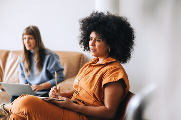 Business woman sitting in a meeting in a modern office