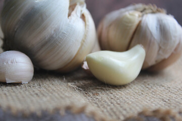 bunch of garlic on brown background