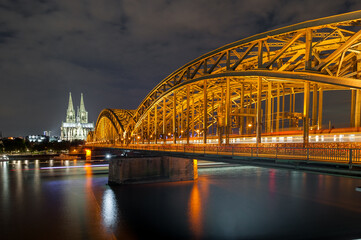 Night Cologne Cityscape with Cologne Cathedral and Hohenzollern Bridge. Germany. Long Exposure.
