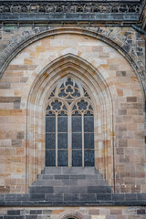 Fototapeta na wymiar St. Vitus Cathedral Outside Window Ornament. Architectural Element. Prague, Czech Republic