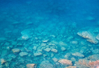 Fototapeta na wymiar Azure waters, Mediterranean, log exposure, calm sea, sea in a sunny day, clear water, environment, blue