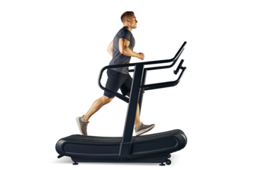 Full length of a muscular sporty man running on a treadmill PNG transparent photo sideview. Young male athlete in sportswear running on treadmill 
