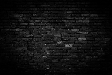 Obraz na płótnie Canvas Black brick walls that are not plastered background and texture. The texture of the brick is black. Background of empty brick basement wall.