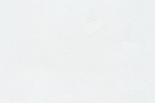 Empty blank concrete white rough wall for background and texture. Beautiful white cement wall plastered surface background pattern. Clean white wall advertising backdrop.