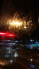 Abstract background street after rain photography wallpaper. Cyberpunk style rain and lanterns...