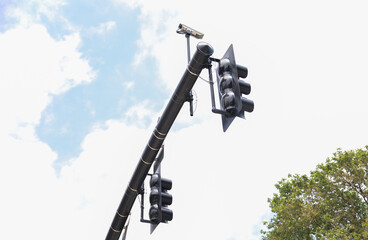 Vibrant street traffic lights illuminate the urban landscape, symbolizing order, control, safety, and the constant flow of city life