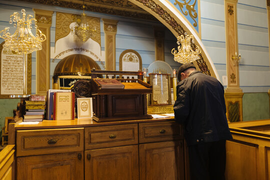 Jewish man praying in synagogue