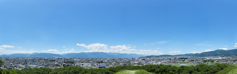 Fototapeta na wymiar 【パノラマ】 初夏、弘法山から見る松本市・北アルプス