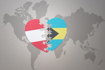 puzzle heart with the national flag of bahamas and austria on a world map background.Concept.