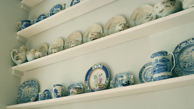 Elegant Display Of Fine China On Wall