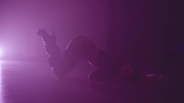 Sexy and graceful dance on high heels is the embodiment of femininity and confidence. The woman moves slowly, showing her elegance and grace. High quality 4k footage