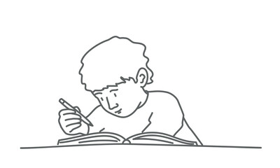 Little boy writing in a book.