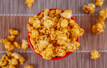 Bowl with delicious caramel popcorn. Homemade Fresh Popped Caramel PopCorn. Sweet caramel flavoured popcorn in bowl.